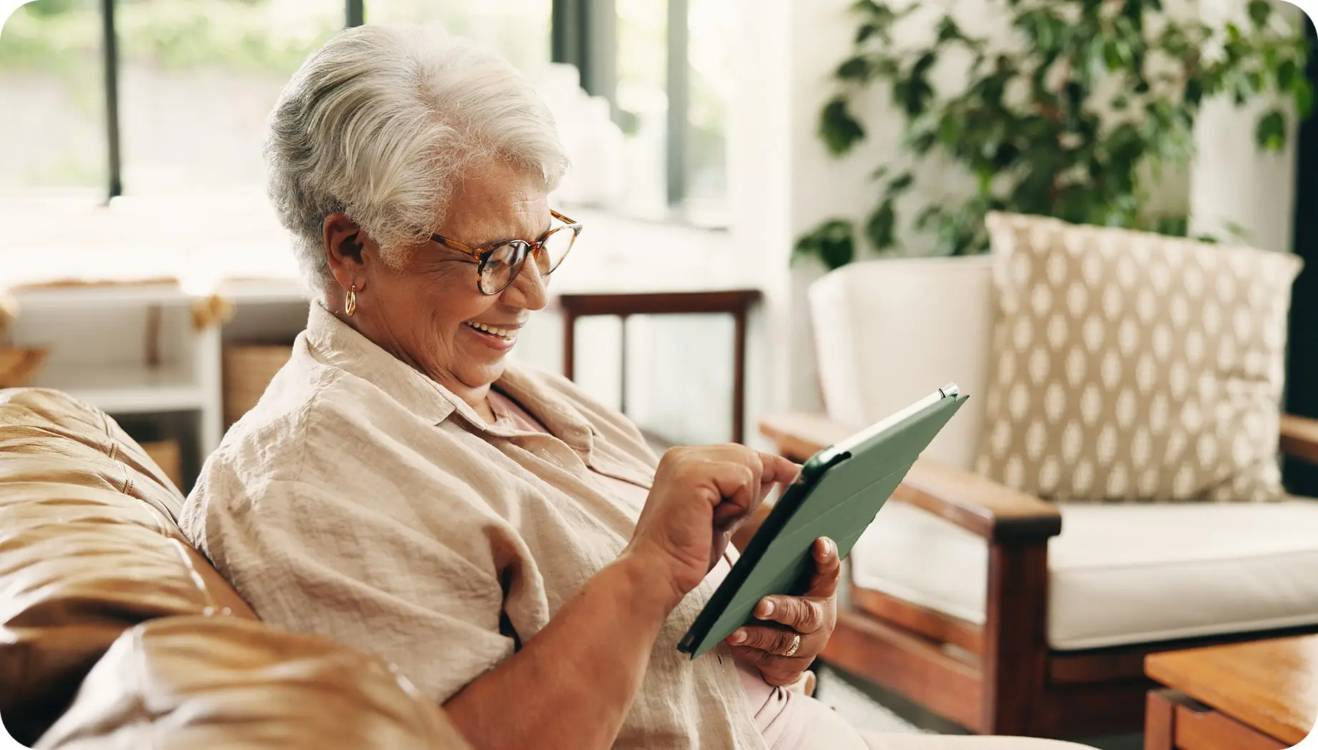 older adult woman using tablet